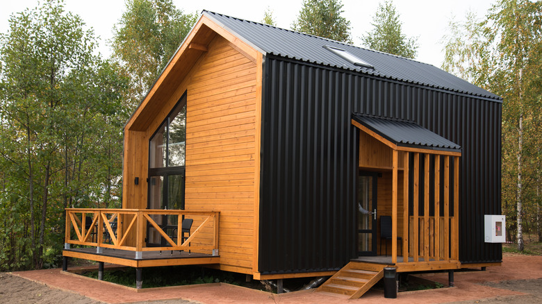 A black tiny house