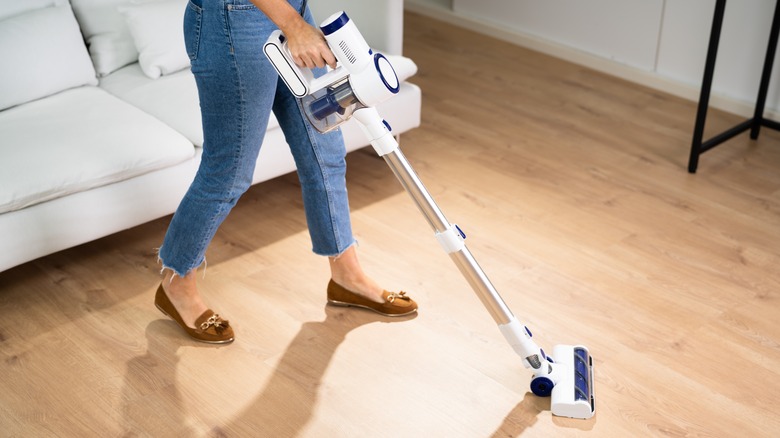 Person sweeping floor