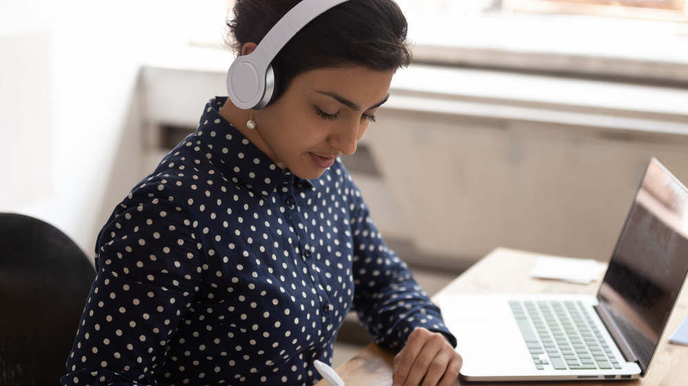 Woman listening to headphones