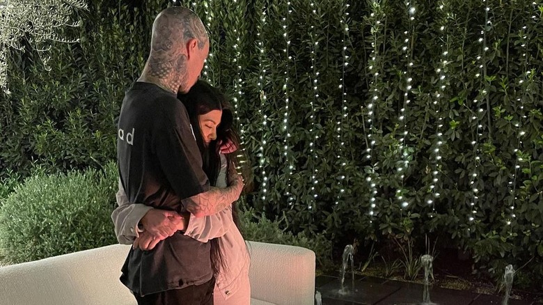 Travis Barker and Kourtney Kardashian hugging