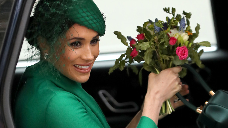 Meghan Markle holding flowers