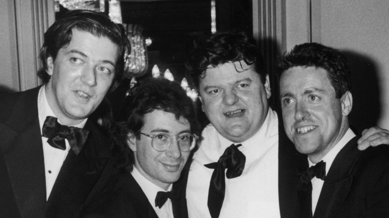 Stephen Fry, Ben Elton, Robbie Coltrane, and Griff Rhys Jones posing