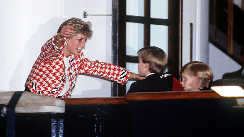 Princess Diana hugging her children