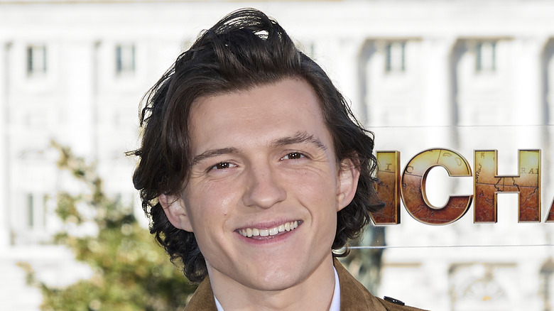 Tom Holland smiling at an Uncharted event