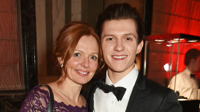 Tom Holland poses with his mom, Nicola Frost, on the red carpet