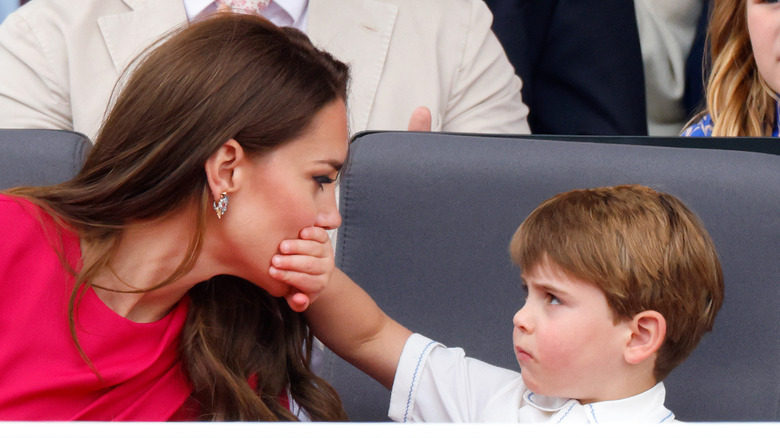 Prince Louis covering Kate Middleton's mouth