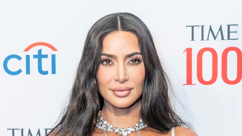 Kim Kardashian slightly smiling