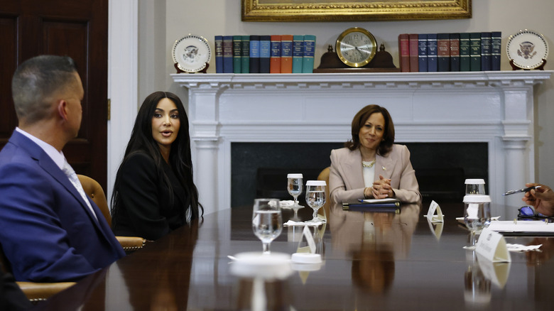 Kim Kardashian and Kamala Harris at a discussion table