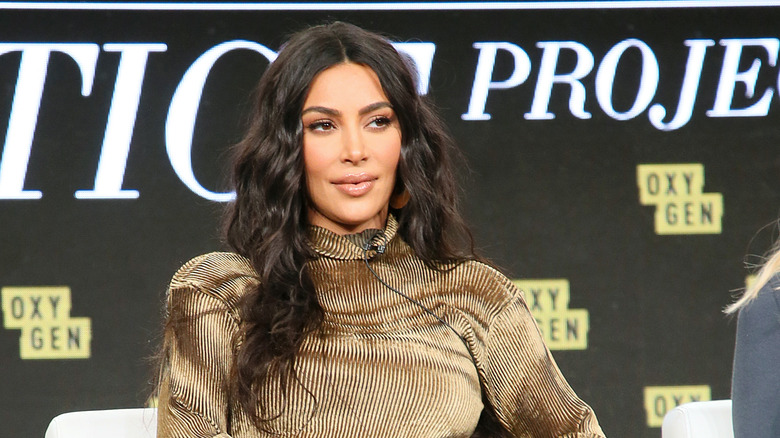 Kim Kardashian in a brown turtleneck