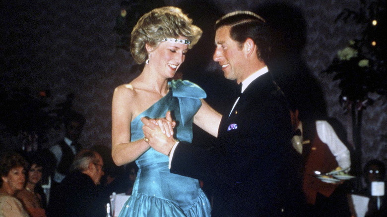 Princess Diana and Prince Charles dancing in formal wear