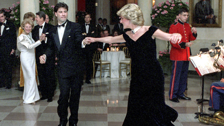 John Travolta and Princess Diana dance with Ronald Reagan and Nancy Reagan in the background