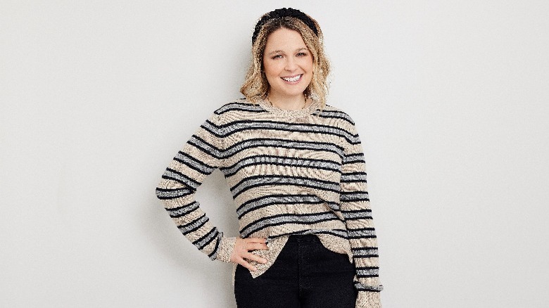 Joanna Teplin smiling in striped sweater