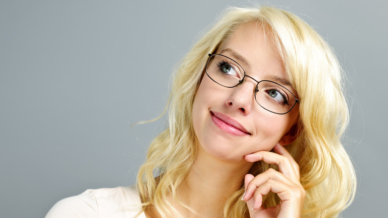 Blonde wearing wire-frame glasses