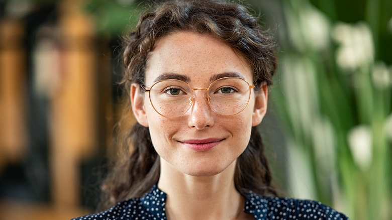 Woman wearing round glasses