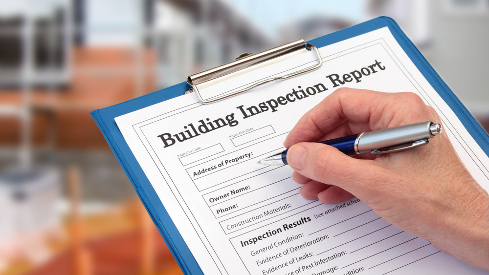 Filling out home inspection report