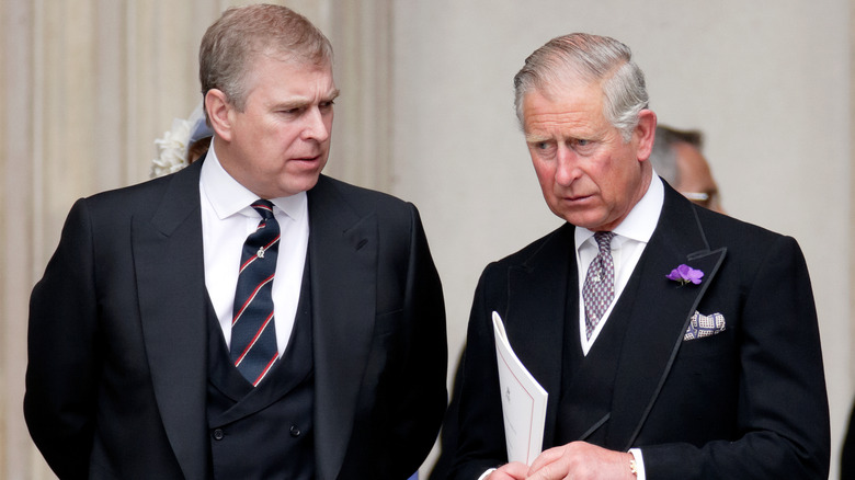 Prince Andrew and King Charles talking