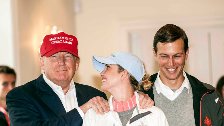 Jared Kushner, Donald Trump, and Ivanka Trump smiling 