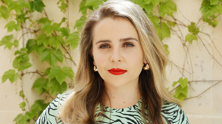 Mae Whitman posing at event 