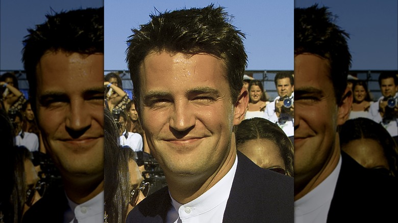 Matthew Perry squinting and smiling