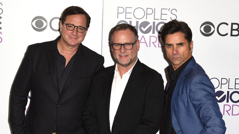 Bob Saget, Dave Coulier, and John Stamos at an event. 