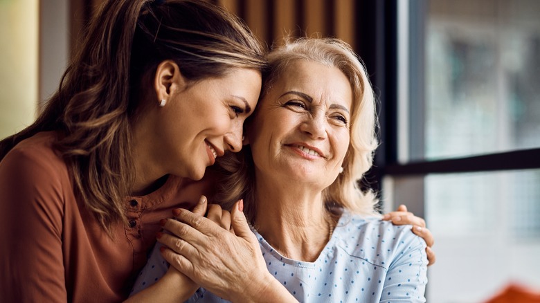 Two women hugging one another