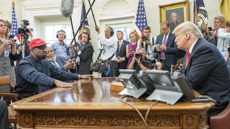 Kanye West talking to Donald Trump in the Oval Office