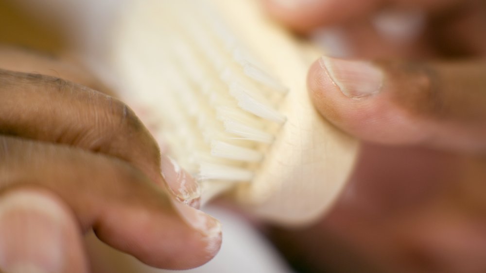 Brushing under the nails