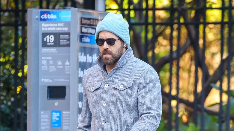 Ryan Reynolds walking in sunglasses