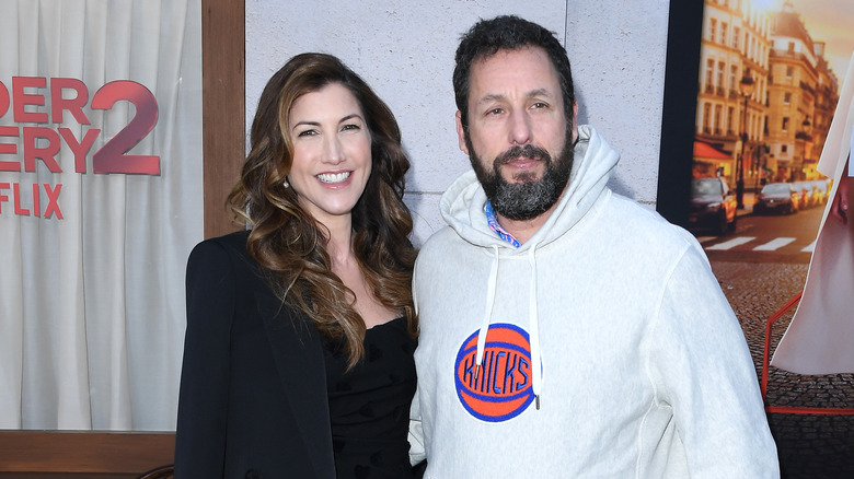 Jackie Sandler smiling with husband