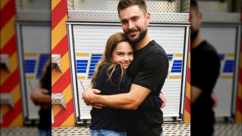 Zac Efron posing with costar