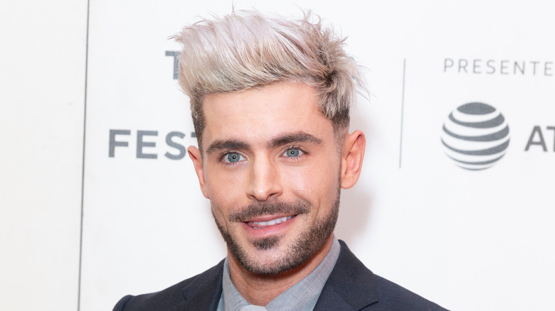 Zac Efron with silver hair. 