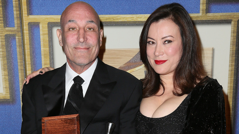 Sam Simon and Jennifer Tilly posing for photos