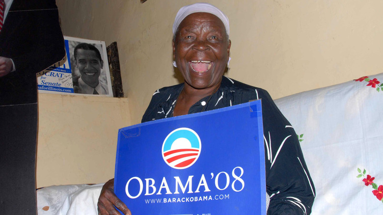 Sarah Obama looking enthusiastic and holding a Barack Obama 2008 campaign sign