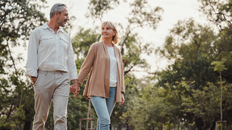 Older couple holding hands