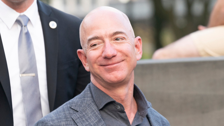 Jeff Bezos smirks at camera