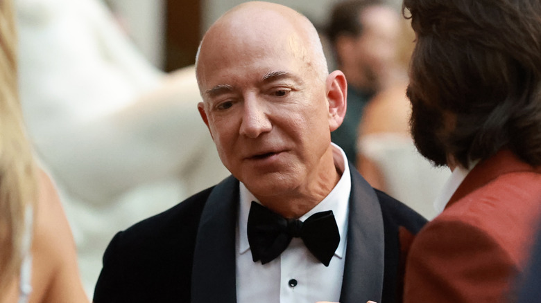 Bezos in suit and bowtie looking serious