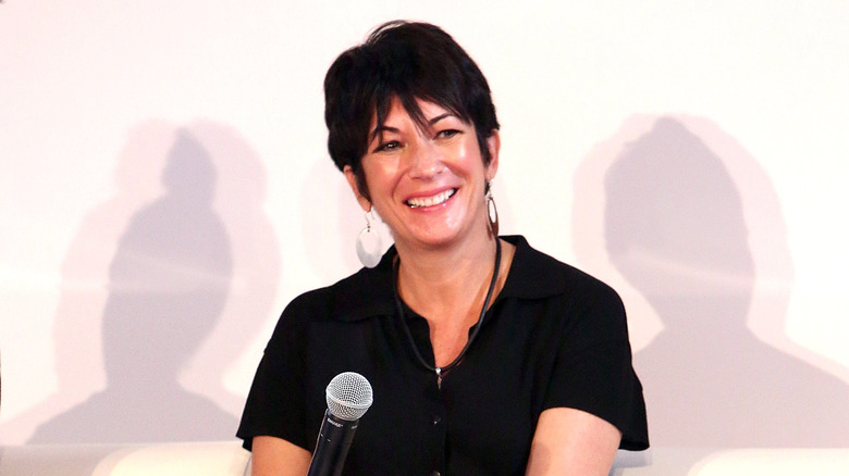 Ghilaine Maxwell smiling with microphone