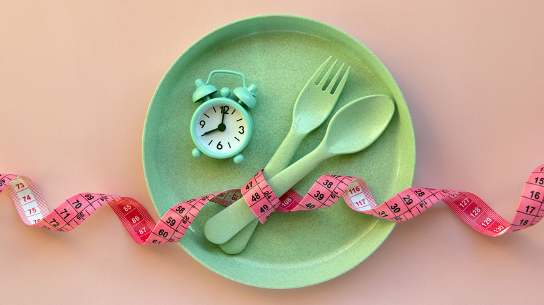 Green plastic plate and cutlery