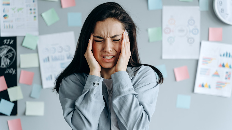 Woman experiencing a headache