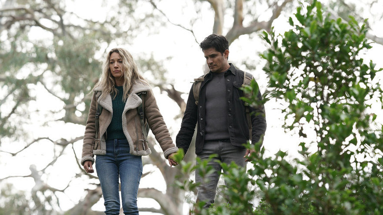 Natalie Zea and Nicholas Gonzalez holding hands in La Brea