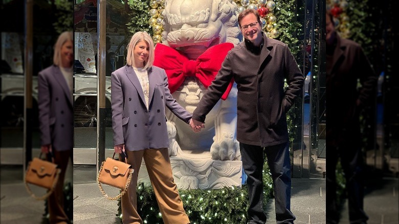 Bob Saget and Kelly Rizzo hold hands at the holidays