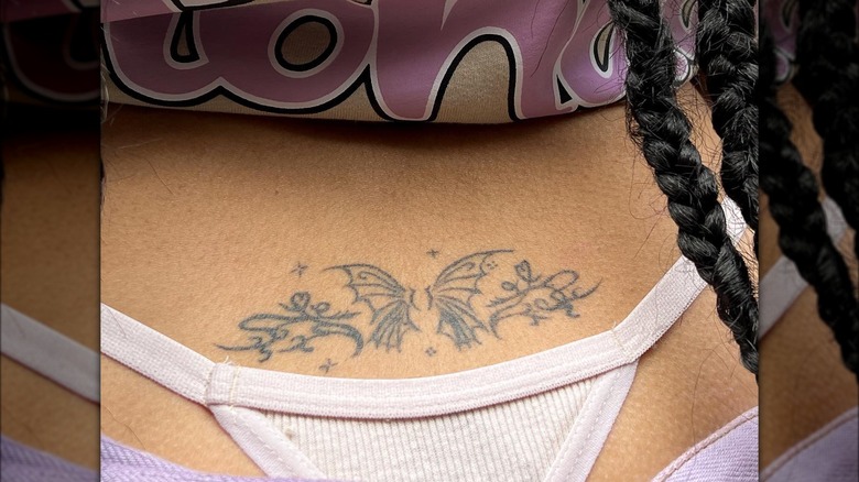 back tattoo featuring a butterfly