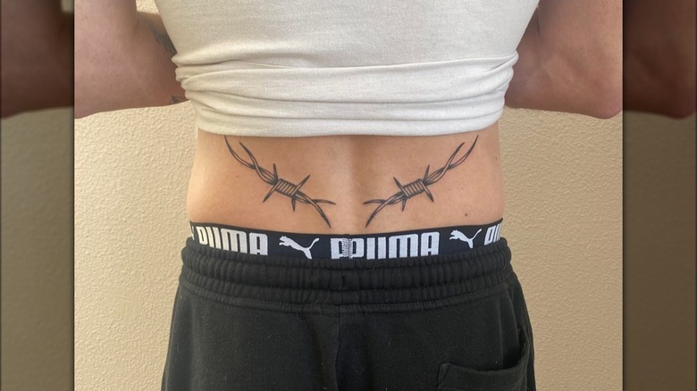 Tramp stamp featuring barb wire