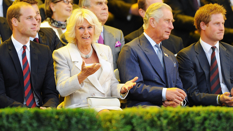 Charles and Camilla sitting with William and Harry