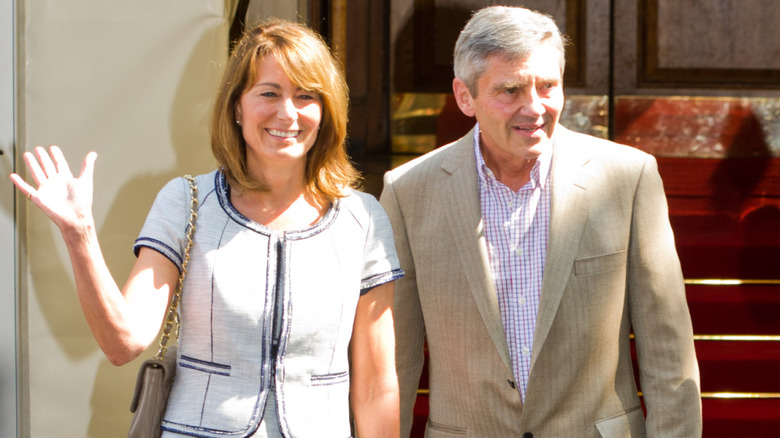 Carole and Michael exit Goring Hotel in London