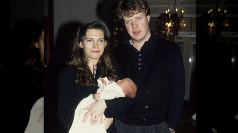 Victoria Aitken and Charles Spencer with their child