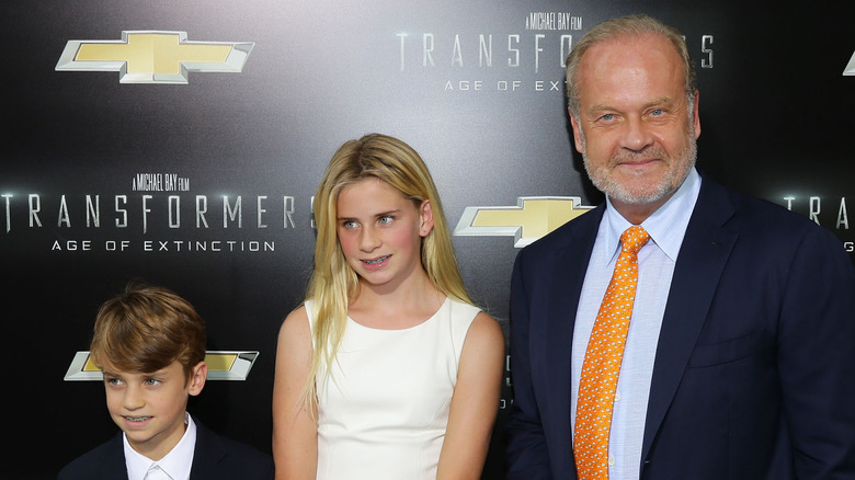 Kelsey Grammer posing with Jude and Mason Grammer red carpet