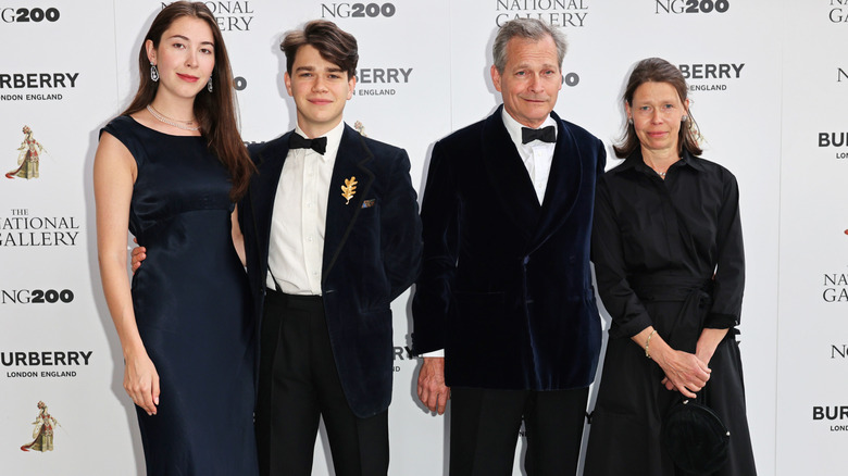 Sam Chatto poses at the National Gallery next to his girlfriend and parents