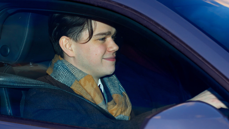 Sam Chatto arrives driving a car to a pre-Christmas lunch at Buckingham palace