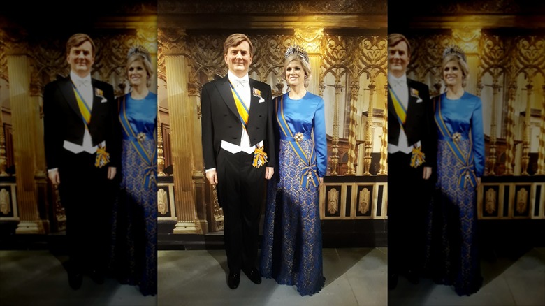 King Willem-Alexander and Queen Máxima wax figures posing